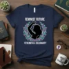 Feminist Future Strength & Solidarity quote on a navy t-shirt with a graphic of a woman's raised fist within a