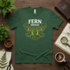 Fern Frenzy t-shirt design featuring white text and a detailed green fern crest graphic