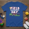 Field Day Kindergarten Day text with colorful illustrations of a race, rainbow, and sun on a royal blue t-shirt