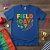 Field Day t-shirt with colorful text and graphics including a soccer ball, stopwatch, trophy, and running figures