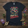 Fight Like a Luchadora t-shirt design featuring a female wrestler in action surrounded by colorful flowers