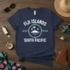 Navy blue t-shirt with "Fiji Islands South Pacific" text and island graphic, featuring coordinates 176° 53' E and 178° 12'