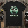 Film Maker t-shirt with retro film camera, clapperboard, and "FILM MAKER" text in vintage green stripes