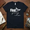 Find your wings and soar quote with a stylized bird graphic on a navy blue t-shirt