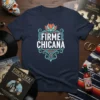Firme Chicana t-shirt design with bold white and turquoise lettering and a colorful lotus flower graphic
