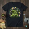 First Day of Spring BLOOM & GROW text with floral wreath graphic on black t-shirt