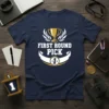 Navy t-shirt with white and gold "FIRST ROUND PICK" text and trophy graphic, celebrating a champion
