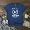 First Time Grammy Est. 2026 t-shirt design with baby feet and laurel wreath
