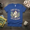 T-shirt design featuring a crowned opossum holding a donut with the text "FIRST OF ALL I'M A DELIGHT" above and