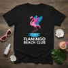 Black t-shirt with "Flamingo Beach Club" text and a pink flamingo graphic, perfect for summer vacation wear