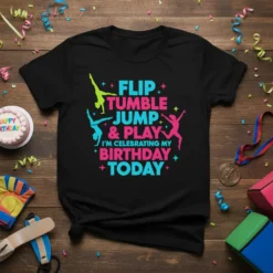 Black t-shirt with "Flip Tumble Jump & Play I'm Celebrating My Birthday Today" in colorful text and gymnastics silhouette figures