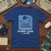 Floppy Disk 1.44 MB text on a blue t-shirt with a neon blue circuit board graphic of a floppy disk