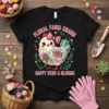 Floral Farm Charm Happy Hens & Blooms text with a cute floral chicken graphic on a black t-shirt