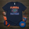 Navy blue t-shirt featuring "Florida Gators" text and a green alligator mascot surrounded by small orange and blue hearts