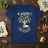Navy t-shirt with "FLOURISH GROW FROM WITHIN ROOTS & REGENERATION" text and a tree of life design featuring a woman