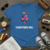 Flower Power Skull graphic tee with a colorful, abstract skull and rose design. Features white text reading "FLOWER POWER SKULL"