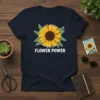 Flower Power text with a vibrant sunflower graphic on a navy t-shirt