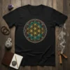 Black t-shirt featuring the Flower of Life sacred geometry pattern in gold, teal, and brown