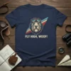 Fly High, Woof! text on a navy t-shirt with a dog wearing aviator goggles graphic
