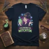 Follow Me On WitchTok t-shirt design featuring a cartoon witch holding a smartphone and social media icons