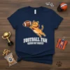 Funny football fan cat t-shirt with text FOOTBALL FAN CATCH MY DRIFT? and a cartoon cat holding a football