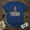 T-shirt with the text "FOOTBALL WILL BE PLAYED BEFORE AND AFTER TONIGHT'S MAIN EVENT" and a marching band tuba player
