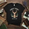 Forest Spirit Wild & Free deer t-shirt with floral wreath design, featuring bold white text and a serene deer graphic