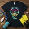 Forget Glass Slippers This Princess Wears Flippers quote on a black t-shirt with mermaid tail and yellow flippers graphic