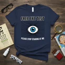 Navy t-shirt with "FREE EYE TEST PLEASE STOP STARING AT ME" text and a blue-eyed eye graphic