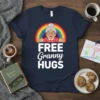 Free Granny Hugs t-shirt design with a cartoon grandma, rainbow, and white text