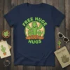 Free Huge Cactus Crew Hugs T-Shirt with three cartoon cacti offering hugs, green and orange text, circular design