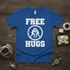 Blue t-shirt with white text "FREE HUGS" and a circular graphic of two wrestlers embracing