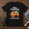 Free Palestine Free Palestine text with Palestinian flag held high, sunset, and doves graphic on a black t-shirt