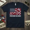 Navy t-shirt with "FREEDOM BLOOMS" text and a stylized American flag design featuring red and white floral patterns