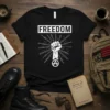 Black t-shirt with "FREEDOM" text above a raised fist, chains, barbed wire, and an anarchy symbol