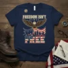 Navy blue t-shirt with "FREEDOM ISN'T FREE" text, eagle, silhouettes of soldiers, and American flag graphic