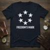 Navy t-shirt with white distressed print of a circle of stars and the text FREEDOM'S MARK