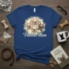 Frenchie Mom t-shirt with a circular wreath of flowers surrounding four cute cartoon French Bulldogs and the text "Frenchie Mom"