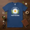 Fresh Blooms Est. 2024 t-shirt with a white daisy graphic and green leaves, printed on a navy blue shirt
