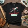 Black t-shirt with "Fresh Dingers HIT DAILY" text and a retro rocket ship graphic flying through stars