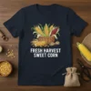 Fresh Harvest Sweet Corn text design with basket of corn and loose kernels graphic