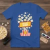 Blue t-shirt featuring a cute kawaii design with the text "fresh POP" surrounded by smiling popcorn clouds