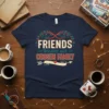 Friends Become Our Chosen Family quote on a navy blue t-shirt with decorative branches and an arrow graphic