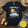 Friends Don't Let Friends Sun Bathing Alone text with beach scene graphic on a dark t-shirt