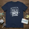 Navy blue t-shirt with white text "FROM THE YAY" and festive graphics, including stars and confetti