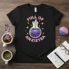 Full Of Anxietea text with a bubbling purple potion in a flask, surrounded by stars, on a black t-shirt