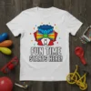White t-shirt with black text "FUN TIME STARTS HERE!" and a colorful clown bow tie and collar graphic, surrounded by
