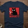Black cat with wide eyes holding a knife, with the word "WHAT?" below, on a navy blue t-shirt