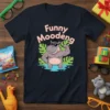 Funny Moodeng text above a cartoon hippo flexing its bicep, wearing sunglasses and a hat, on a dark t-shirt