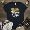 Future Trophy Wife text design in gold and white script with sparkling stars on a black t-shirt